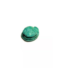 Load image into Gallery viewer, a green frisbee sitting on top of a table