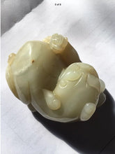 Load image into Gallery viewer, A small Chinese jade figure of a Buddhist lion with  cub.