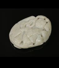 Load image into Gallery viewer, Oval Chinese carved nephrite amulet depicting a figure with a phoenix, bat, carp and string of coins.