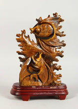 Load image into Gallery viewer, Chinese carved tiger's eye scalar or sailfin fish group on stand.
