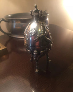 a glass vase with a horse on top of it 
