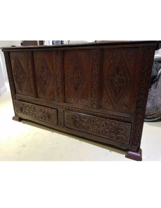 A Queen Anne carved and paneled oak mule chest..