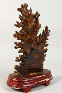 Chinese carved tiger's eye scalar or sailfin fish group on stand.