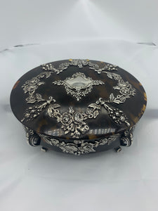 A Victorian silver mounted tortoiseshell oval dressing table jewel casket, George Fox, London 1892