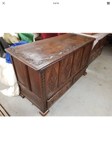 A Queen Anne carved and paneled oak mule chest..