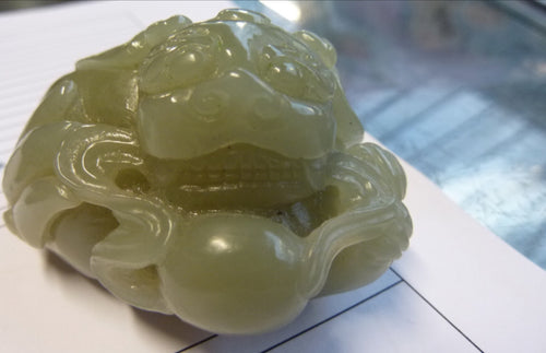 Chinese Nephrite Jade carving of a mythical beast with the flaming pearl.