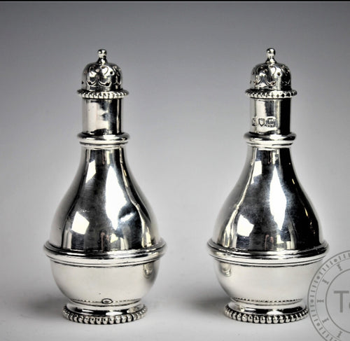A pair of George V Silver pepper pots..