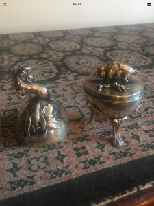 a couple of vases that are on a table 