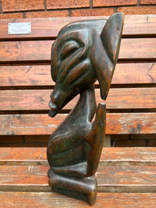 A 19th century African tribal carved wood stylised figure.