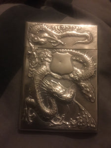 A  Chinese export silver rectangular card case dragon and prunus flowers.