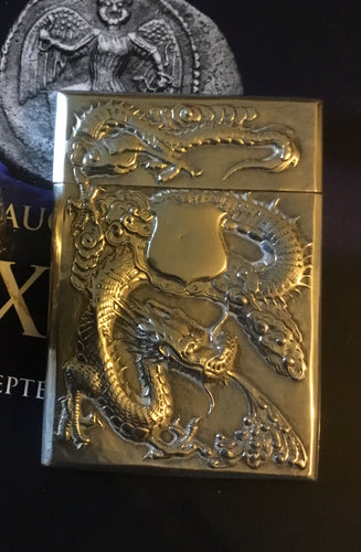A  Chinese export silver rectangular card case dragon and prunus flowers.