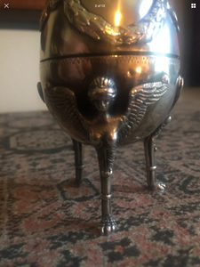a close up of a wine glass on a table 
