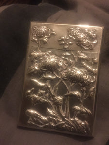 A  Chinese export silver rectangular card case dragon and prunus flowers.