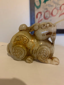 A nephrite/jade carving of a foo dog..