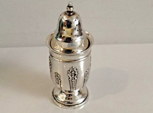 Antique Silver part embossed Edward VII Pepper pot by Henry Mathews , Birmingham 1904.