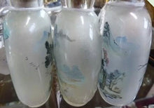 Load image into Gallery viewer, Three Chinese internally painted glass snuff bottles, each decorated with landscapes.