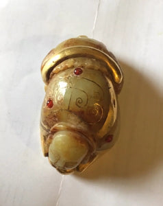 An unusual Chinese possibly gold mounted jade crouching figure.