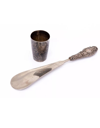 Siamese (Thailand) niello silver 'tot' glass, together with a shoe horn, weighted silver grasp.