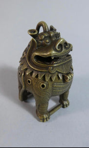 A Small 19Th Century Bronze Koro in the form of a Squat Temple lion standing on  a snake.