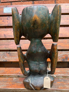 A 19th century African tribal carved wood stylised figure.