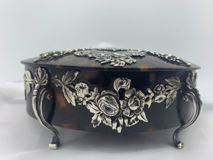 A Victorian silver mounted tortoiseshell oval dressing table jewel casket, George Fox, London 1892
