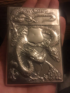 A  Chinese export silver rectangular card case dragon and prunus flowers.