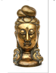 A Chinese bronze bust in the form of Guan Yin.