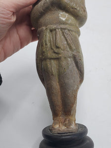 A straw-glazed figure of an attendant. c. Sui Dynasty (541-604)
