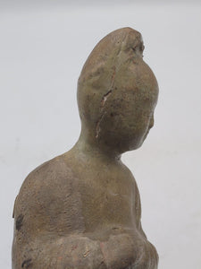 A straw-glazed figure of an attendant. c. Sui Dynasty (541-604)