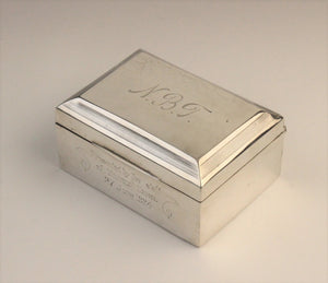 A George V silver cigarette box by F H Adams & Co, Birmingham 1922
