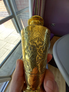 An embossed Islamic styled brass vase