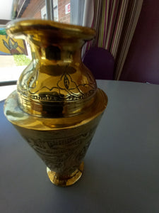 An embossed Islamic styled brass vase