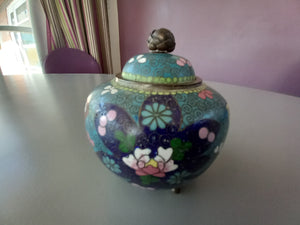 A Chinese cloisonne koro having three foot base with decoration of flowers on blue background