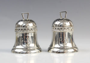 A pair of Victorian novelty bell-shaped silver pepperettes by Horace Woodward & Co, Birmingham 1884