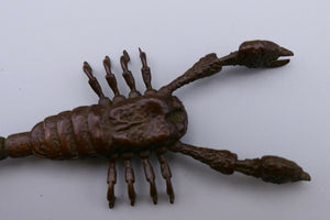 A copper/bronze model of a scorpion