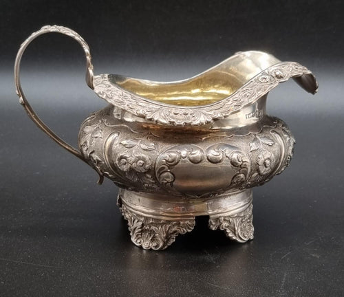 A William IV silver circular cream jug